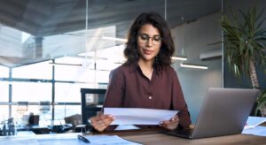 Focused business owner looking at financial business plan