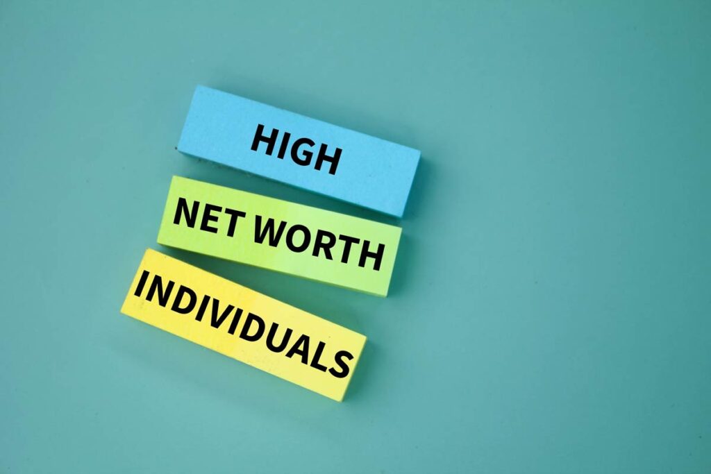 Paper with words high net worth individual printed on them