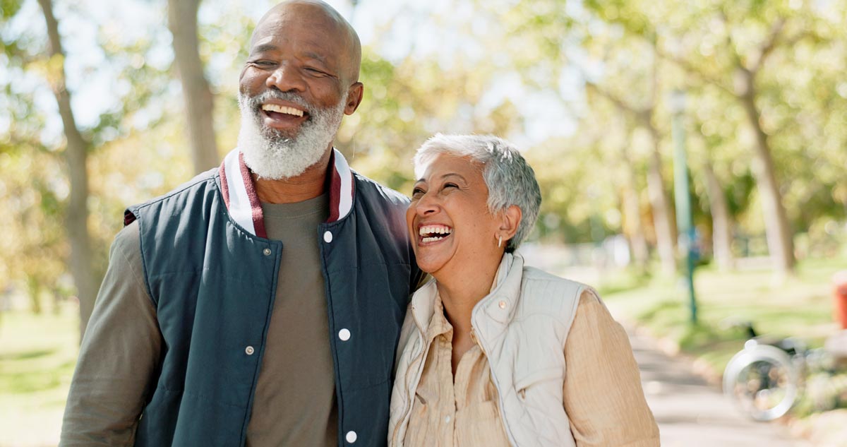Senior couple on a walk smiling
