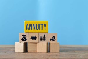 Wooden blocks labeled “annuity”. 