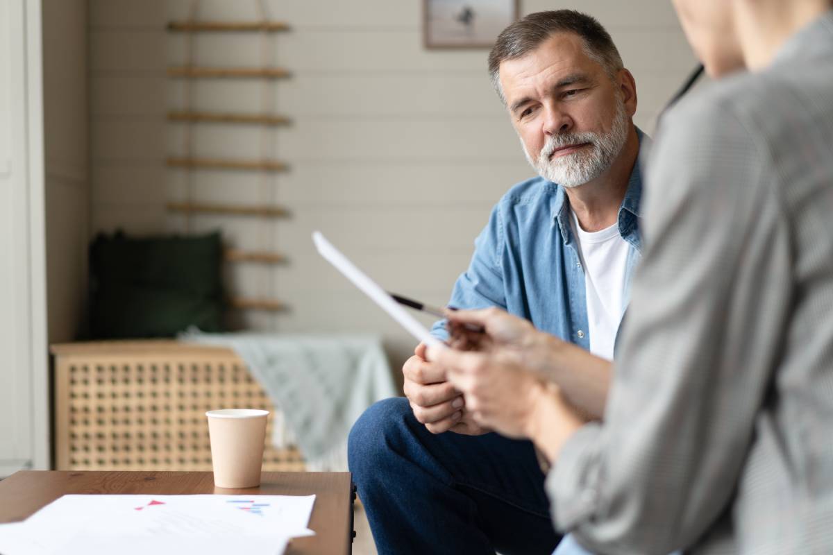 Man reviewing tax strategies with a financial advisor