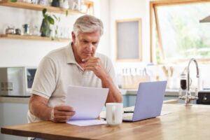 Older gentleman reviewing tax paperwork