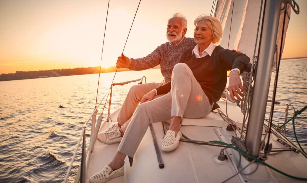 Mature, affluent couple enjoying time spent on a boat in retirement