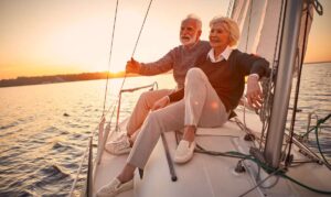 Mature, affluent couple enjoying time spent on a boat in retirement