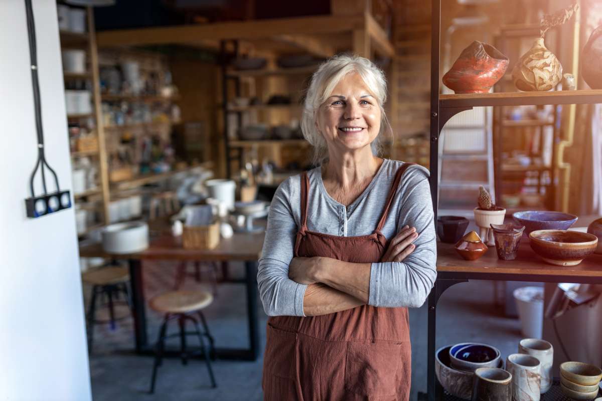 Mature small business owner standing in her workshop