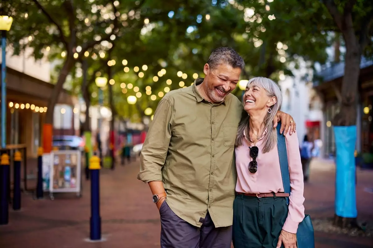 Happy older couple walking