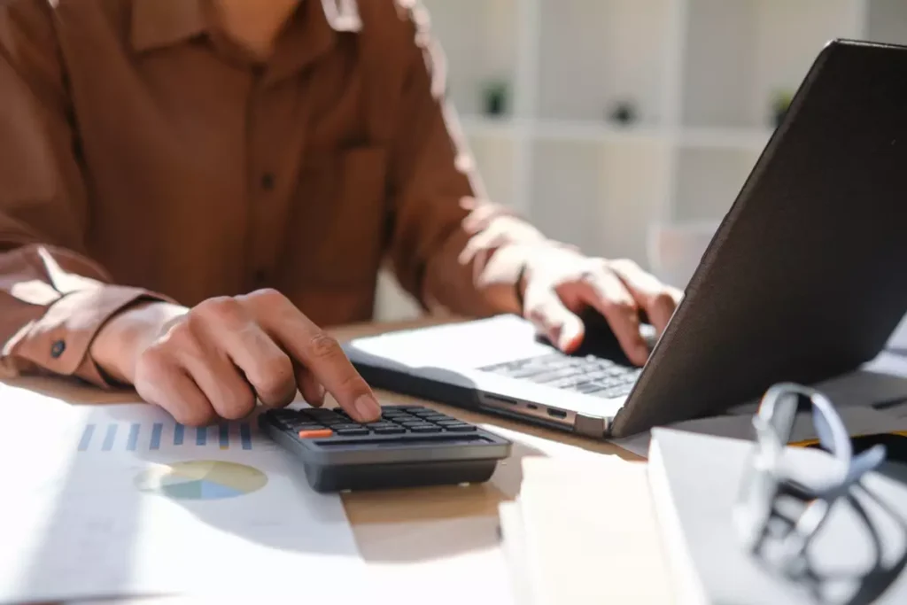 Business owner entering financial data
