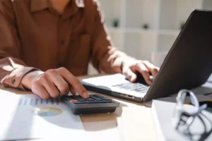 Business owner entering financial data