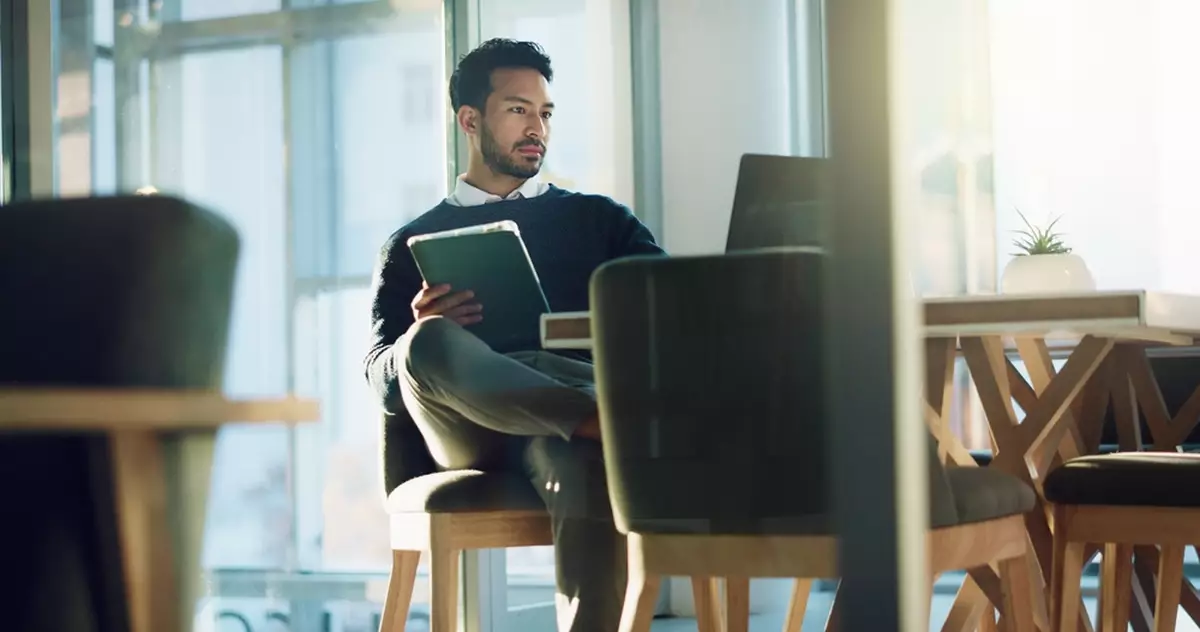 Tablet, laptop and reading with business man in office for planning