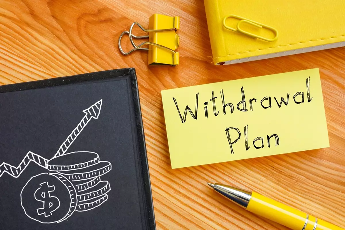 A note that reads, 'Withdrawal Plan,' as the writer wonders about retirement account withdrawal rules.