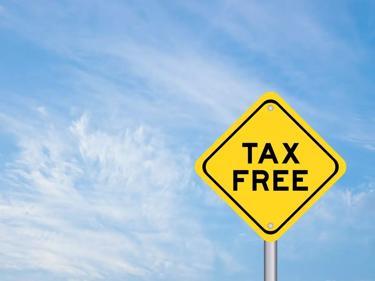 Yellow road sign with 'tax-free' written on it